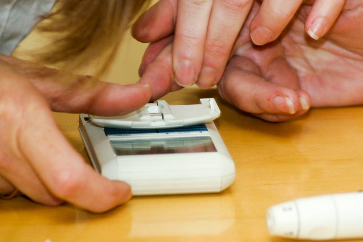 Metabolism Risk Assessments showing a person reviewing lab results with a healthcare provider